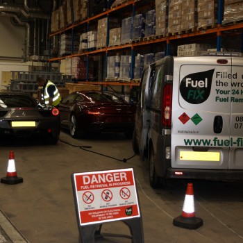 Fuel Fix van at work alongside danger sign